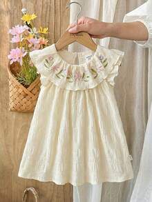 SHEIN Vintaside Kids 女婴甜美花卉图案吊带背心和牛仔短裤套装，蝴蝶结装饰，适合休闲外出、家庭聚会、夏日漫步、舞蹈主题活动、女婴生日派对等场合。 - 杏色 - 查看 4