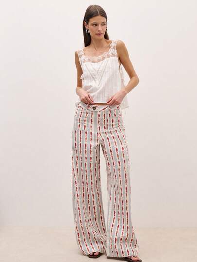 Nöista Wide-Leg Pants In A Fishes And Stripes Printed Fabric With A Mid-Rise Waistband, Button Closure, Front Pockets. Spring, Summer, Easter.