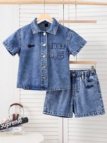 SHEIN Young Boy Fashionable Cozy Cotton Denim 2pic Set,  Medium Wash Blue With Button Front Fastenning Short Sleeves Shirt Top, A Pratical Flat Pockets , Street Cool Style Letters Embroidered Detail, Light Weight Cotton Fabric For Summer Daily , Spring Vacation Shorts For Boys, Boys Relax Denim Shorts, Preppy School Ootd Fashion Item, Casual Basic Shorts For Boys, Boys Dneim Shorts, Jean Shorts For Young Boys, Young Boys Shorts, Holiday Kids Wear, Easter Kids Wear, Mother's Day Kids Wear. Young Boys Burmuda Shorts.Versatile Casual Summer Fashion Item For Kids - Blue - View 1