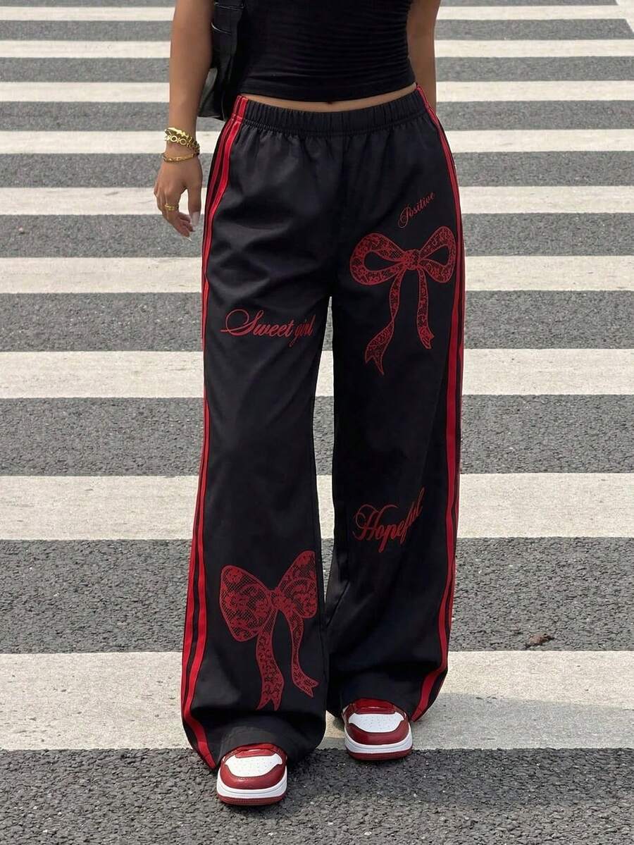 SHEIN 百搭宽松蝴蝶结印花休闲裤,适合青少年女孩日常穿着、通勤、休闲、度假、朋友聚会、街头摄影等场合。 - 紅色 - 查看 1