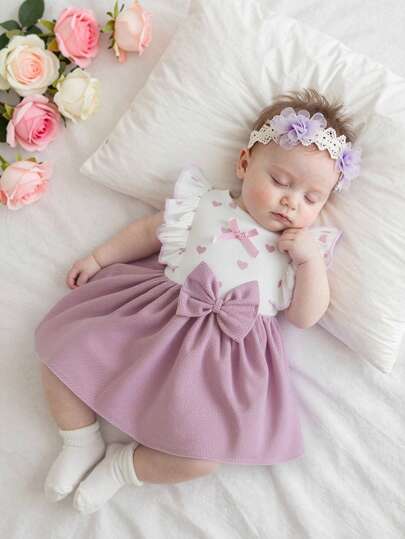 Vestido de verano sin mangas con cuello redondo y diseño de corazón para bebé niña recién nacida, con lazo en la cintura, diseño de espalda abierta, fácil de usar, elegante y lindo estilo de moda, tela cómoda, adecuado para salidas diarias u al aire libre