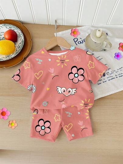 SHEIN LMoss Kids Cute Graffiti Face Flower Heart Print, Baby Girl Casual Loose Round Neck Short Sleeve T-Shirt And Tight Shorts Set, Suitable For Spring/Summer Vacation