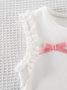 SHEIN Genkimix Kids 小女孩可爱荷叶边花朵蝴蝶结装饰吊带背心搭配拼布蛋糕裙套装，适合度假和外出穿着 - 白色 - 查看 9
