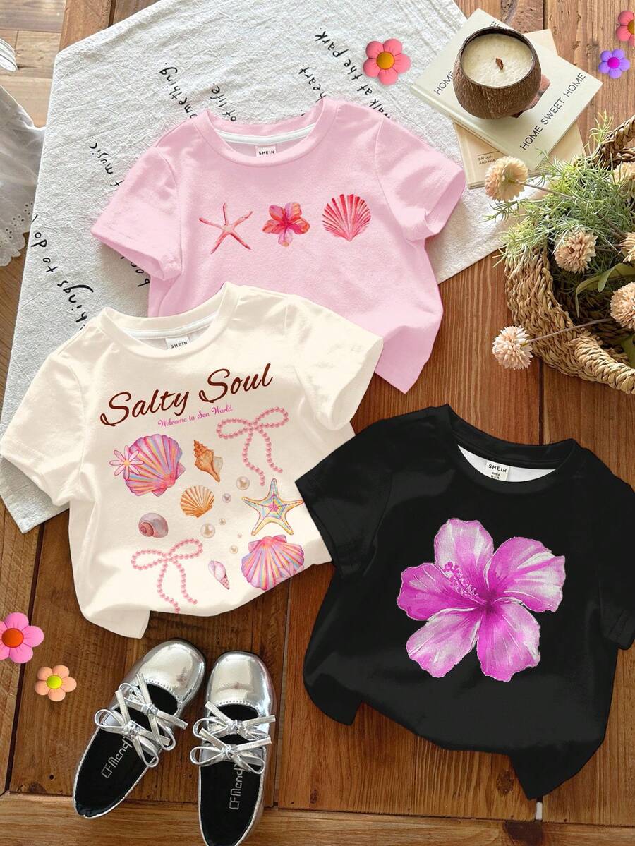 SHEIN LMoss Kids 3件套休闲度假热带花卉图案基础款圆领短袖T恤,包含芙蓉花、鸡蛋花、海星、珍珠贝壳海滩场景图案,适合年轻女孩,休闲简约,适合春夏穿着,颜色有黑色、米色和浅粉色。 - 彩色 - 查看 1