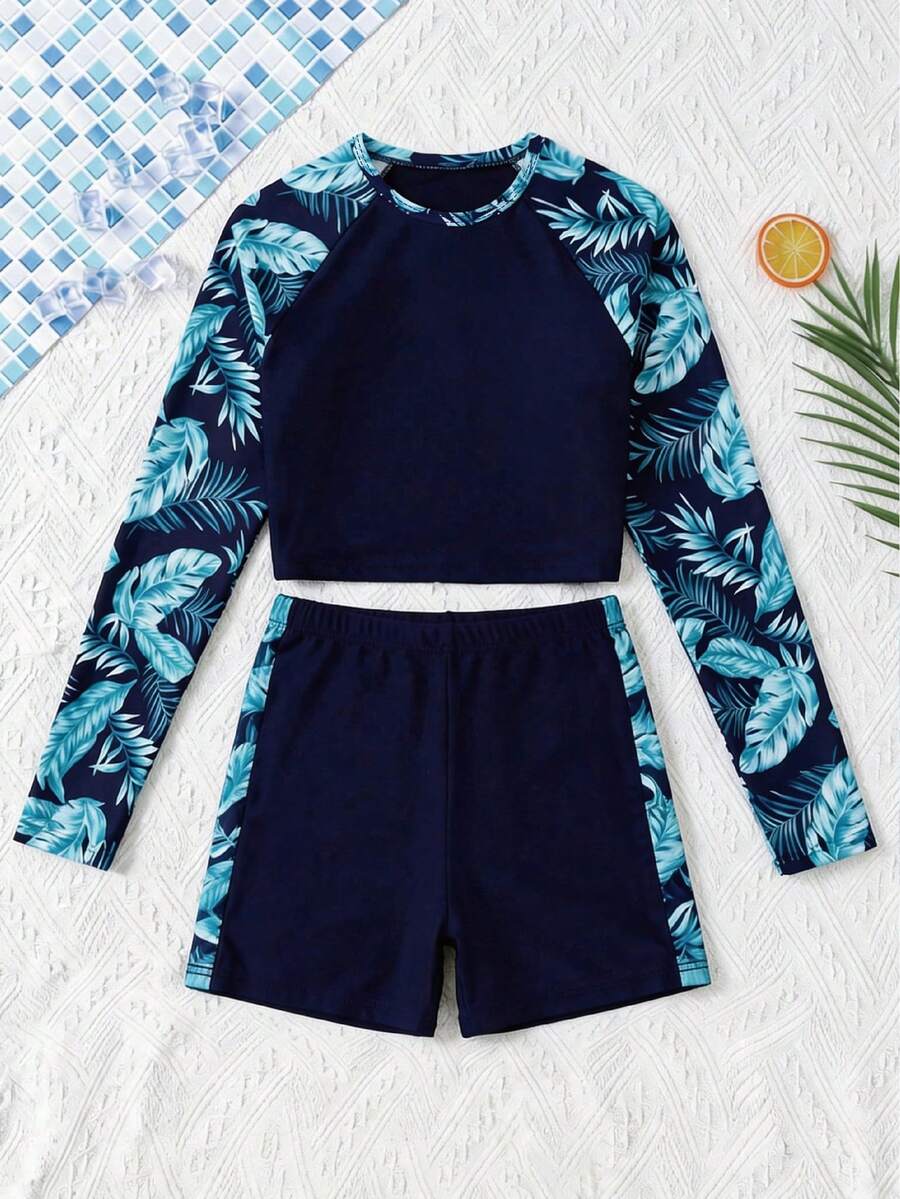 SHEIN Conjunto de traje de baño para niña preadolescente con parte superior de manga raglán con estampado de plantas tropicales y shorts - Azul Marino - Ver 1