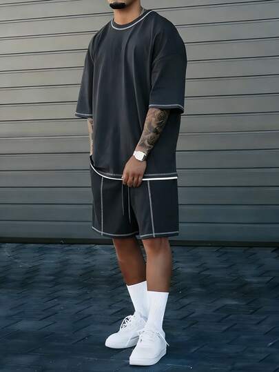 Manfinity CasualCool Conjunto de camiseta de manga corta de cuello redondo gris oscuro y pantalones cortos para hombre