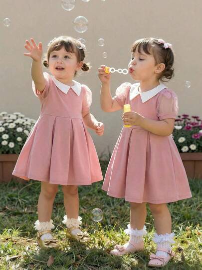 Baby Girls Black Short Sleeve Dress, Unique Design Showcasing And Elegant Princess Style. X-Shaped Waistline Accentuates The Silhouette, Displaying A Charming And Sweet Elegant. Classic White Contrast Collar Adds A Fresh Touch, Making The Overall Look More Outstanding.