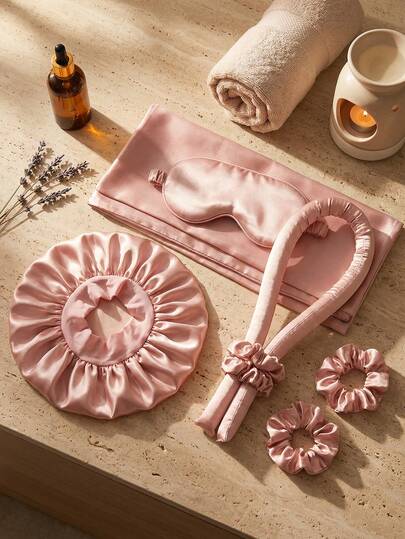 8件套干发护理套装，含枕套、亲肤睡帽、遮光眼罩、免加热卷发棒和发带，助您安享睡眠。