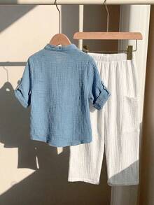 SHEIN 两件套男童休闲运动度假套装 - 白色短袖衬衫搭配松紧腰带口袋长裤，适合儿童穿着，也适合小男孩、返校季、生日派对、晚宴、演出、婚礼、情人节、日常穿着、上学、旅行、运动、春夏季节等场合。 - 淺藍色 - 查看 2