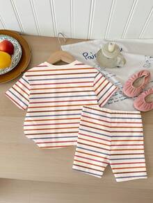 SHEIN Bộ 2 món cho bé gái, chất liệu Dopamine, kiểu dáng thường ngày, họa tiết sọc và thêu hoa nhiều màu sắc, mềm mại, cổ tròn, tay ngắn và quần short ôm sát, thích hợp mặc hàng ngày vào mùa xuân/hè, đi chơi, nghỉ lễ, lễ Phục sinh. - Nhiều màu - Xem 2