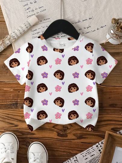 DORA | SHEIN Camiseta de manga corta con estampado de personaje de dibujos animados y floral para niña, estilo casual para uso diario, viajes y vacaciones