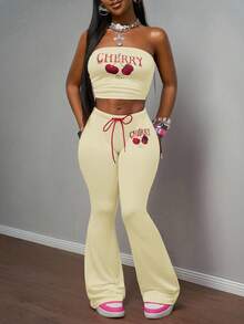 Slaydiva 2025 Spring/Summer New Bohemian Music Festival Countryside Style Easter Casual Daily Beach Vacation Party Street Fashion Sexy Sweet Cute Y2K Pink Elastic Knit Fabric Red Cherry Fruit English Letter Graphic Retro American Print Sleeveless Cold-Shoulder Tight Bandeau Crop Top Paired With Pink Elastic Waist Red Rope Tie Cherry Print Tight Flare Pants Women 2-Piece Set - Light Yellow - View 1