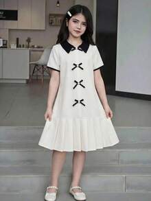 Elladie kids Đầm bé gái tuổi teen mùa hè 2026 mới, chất liệu vải trắng phối cổ và tay áo đen, eo có dây rút, gấu váy xếp ly, trang trí nơ, kiểu dáng tối giản, thoải mái, dáng rộng, ngọt ngào, phong cách preppy. - trắng - Xem 4