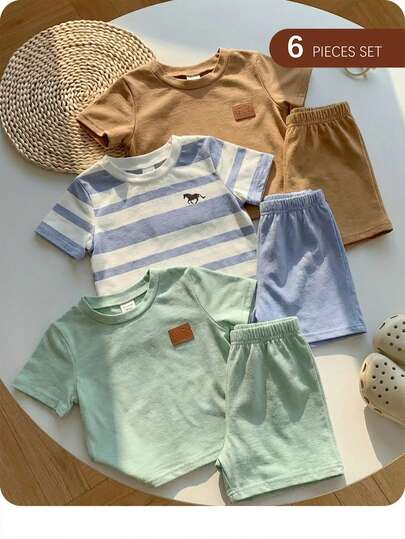 Bộ 6 món gồm áo thun ngắn tay và quần short in chữ logo màu trơn dễ thương, thích hợp cho cả bé trai và bé gái vào mùa xuân và mùa hè.