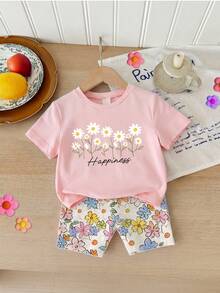Bộ 2 món cho bé gái 4-7 tuổi: Áo thun ngắn tay in họa tiết hoa cúc và chữ "HAPPINESS" (Hạnh phúc) kèm quần short. Trang phục nhẹ nhàng, năng động và bắt mắt, phù hợp mặc hàng ngày, đi học, dự tiệc sinh nhật, dã ngoại, ngày thiếu nhi, mùa xuân/hè/thu. - Nhiều màu - Xem 4