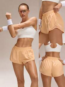 GLOWMODE Quần short thể thao cạp thấp 2,5 inch thoáng mát, nhanh khô, nhẹ, có túi khóa kéo, dải phản quang, tích hợp lớp khử mùi, thích hợp cho chạy bộ, tập luyện, tập gym, tập thể dục, ngày Valentine. - trái cam - Xem 9