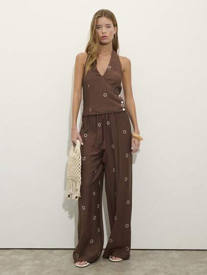 Nöista Two Pieces Set With A Halter V-Neck Top And Matching Wide-Leg Pants In Textured Brown Fabric With Sun Embroidery. . Perfect For Travel, Weekends, And Summer Days, Vacation Outfit, Boho, Festival, Spring, Holiday Look.