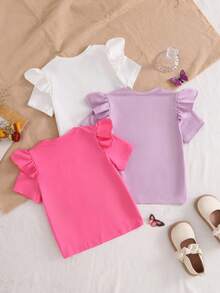 Genkimix Kids 三件套女童短袖T恤，荷叶边设计。这些针织圆领短袖上衣适合春夏穿着，轻薄透气，纯色设计，宽松舒适。它们柔软亲肤，适合日常穿着、上学等场合。 - 彩色 - 查看 2