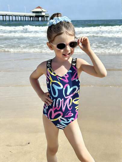 少女彩色爱心印花针织连体泳衣，交叉肩带设计