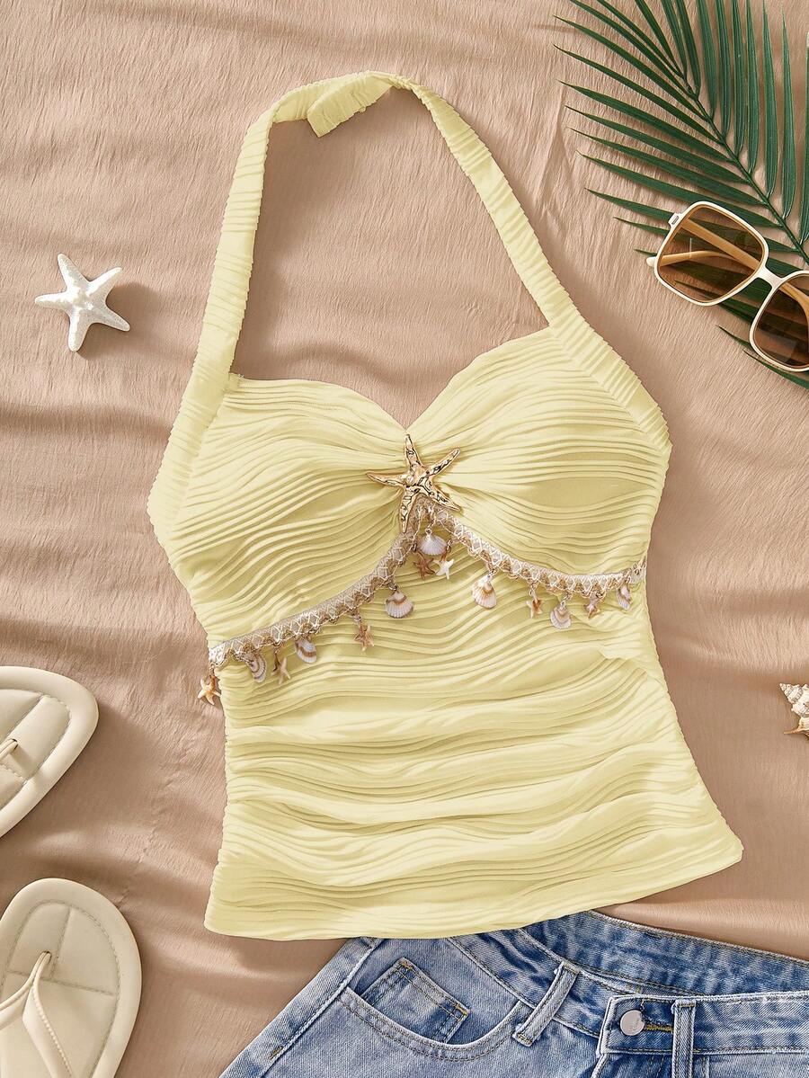 Sparklyn 这款少女吊带背心采用亮黄色设计,清新甜美,充满夏日气息。3D波浪纹理面料,细肩带设计贴合颈部线条,胸前金色海星装饰和镂空蕾丝花边更添度假俏皮感。搭配牛仔裤,打造日常休闲造型或海滩度假风,让年轻女孩舒适又时尚,轻松成为人群焦点。 - 黃色 - 查看 1