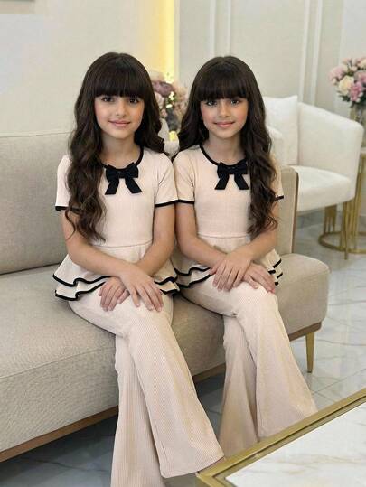 两件套女童优雅休闲套装，黑色3D蝴蝶结简约撞色罗纹针织面料，修身荷叶边短袖上衣搭配喇叭裤，适合外穿，优雅套装，日常通勤，女童春夏校服