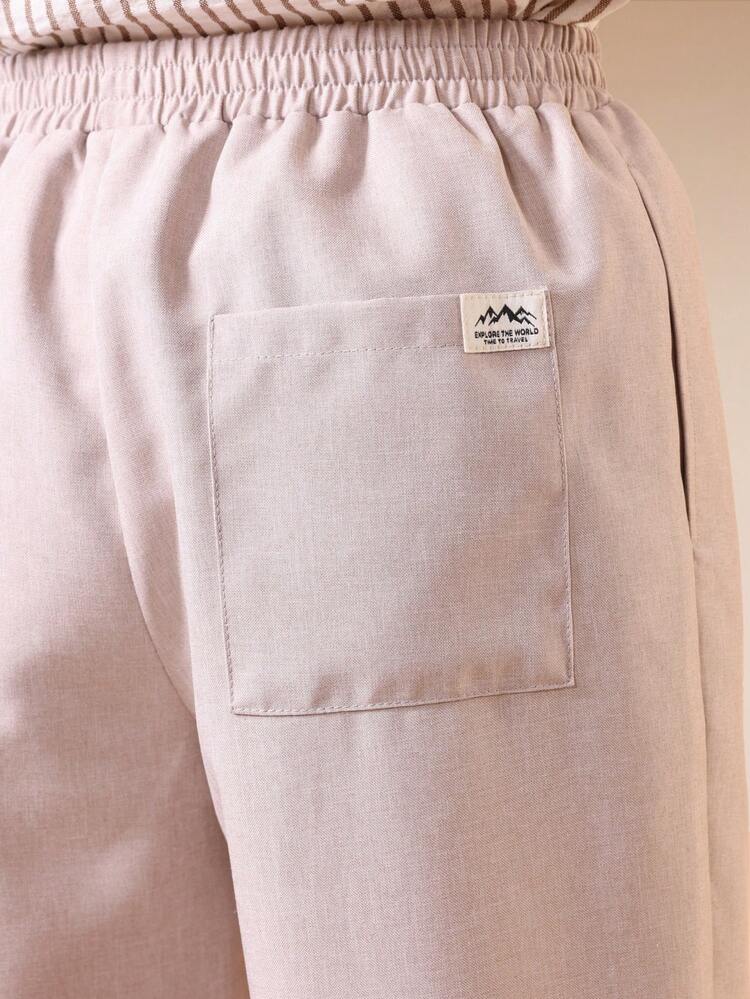 Pleated Linen Feel Trousers With Cuffed Hem And Relaxed Wide Leg Fit For Casual Summer Occasions