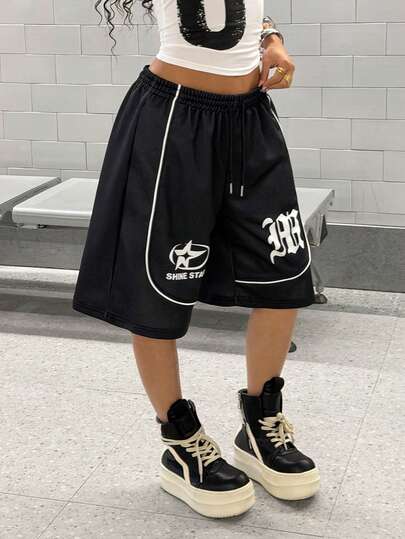 SHEIN HypeZone Pantalones cortos casuales con estampado floral blanco sobre base negra y cordón ajustable para mujer