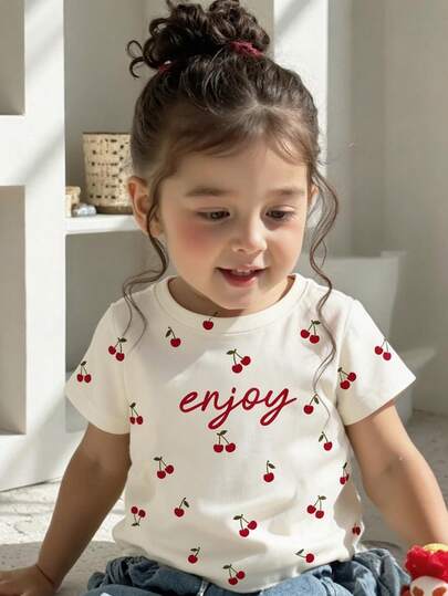 SHEIN Cream Almond, Cute Retro Letter & Sweet Mini Cherry Print, Baby Girl Casual Minimalist Short Sleeve Round Neck T-Shirt, Suitable For Spring/Summer Daily Wear, Outing, Vacation, Holiday, Farm, Picnic, Homecoming, Back To School