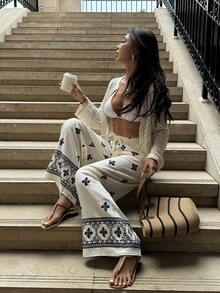 Pariaura Quần ống rộng kiểu Pháp Bohemian, màu xanh nhạt, họa tiết cỏ bốn lá. Eo co giãn có dây rút + gấu quần rộng, thoải mái. Thêu họa tiết hình học ở gấu quần. Phong cách đa năng, phù hợp mặc hàng ngày. - Màu be - Xem 4