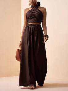 Zivah Lễ hội âm nhạc Xuân/Hè 2026, Lễ Phục Sinh, Ngày Thánh Patrick, Ngày Valentine, Hẹn hò, Phong cách miền Tây, Phong cách du mục, Tiệc sinh nhật, Lễ tốt nghiệp, Đại học, Sinh viên, Trang phục hàng ngày, Phối đồ cơ bản, Thường ngày, Kỳ nghỉ, Du lịch tàu biển, Bãi biển, Tắm nắng, Xu hướng thịnh hành, Thời trang đường phố, Khách dự đám cưới, Người đi làm, Ăn sáng muộn, Sân bay, Tiệc tùng, Đi chơi ngày lễ, Trang phục công sở, Bộ 2 món gồm áo cổ yếm buộc dây và quần ống rộng xếp ly màu nâu chất liệu vải lanh. - màu nâu - Xem 6