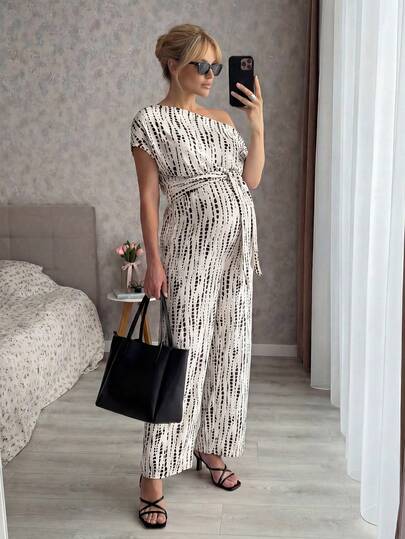MaterniWear Summer Outfits Maternity Work Clothes Maternity Work Outfits Maternity Work Jumpsuits Maternity Abstract Print Jumpsuit With Off-Shoulder Belt Maternity Summer Casual Vacation Style All-Over Print Asymmetrical Neck Tie Waist Loose Wide Leg Jumpsuit Elegant Jumpsuit Boho Jumpsuit Dressy Jumpsuit Women's Jumpsuit Off Shoulder Jumpsuit Maternity Jumpsuit Bump Friendly Jumpsuit Women Vacation Jumpsuit Patterned Jumpsuit Summer Jumpsuit Vacation Outfits Women Spring Outfits For Women Dresses For Women Holiday Outfits For Women Women Pregnancy Clothes Maternity Clothes Co Ord Pregnancy Outfits Two Piece Women 2 Piece Outfit Casual Women Vacation Outfit Sets