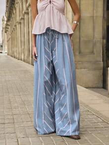 Nöista Quần dài màu xanh dương và tím in sọc rộng, chất liệu denim, có dây buộc eo và chun ở cạp quần, họa tiết sọc phối hợp. Thích hợp cho lễ hội âm nhạc, mùa hè, mùa xuân, đi biển, trang phục thường ngày cho nữ. - Màu xanh lam - Xem 1