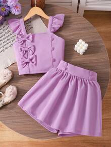 Bộ áo và quần short màu vàng bơ kiểu công chúa ngọt ngào cho bé gái, thích hợp cho mùa xuân/hè, áo tay loe nhiều lớp với khuy cài và nơ, gồm 2 món, phù hợp mặc hàng ngày và các bữa tiệc nhỏ. - Màu tím hoa cà - Xem 11