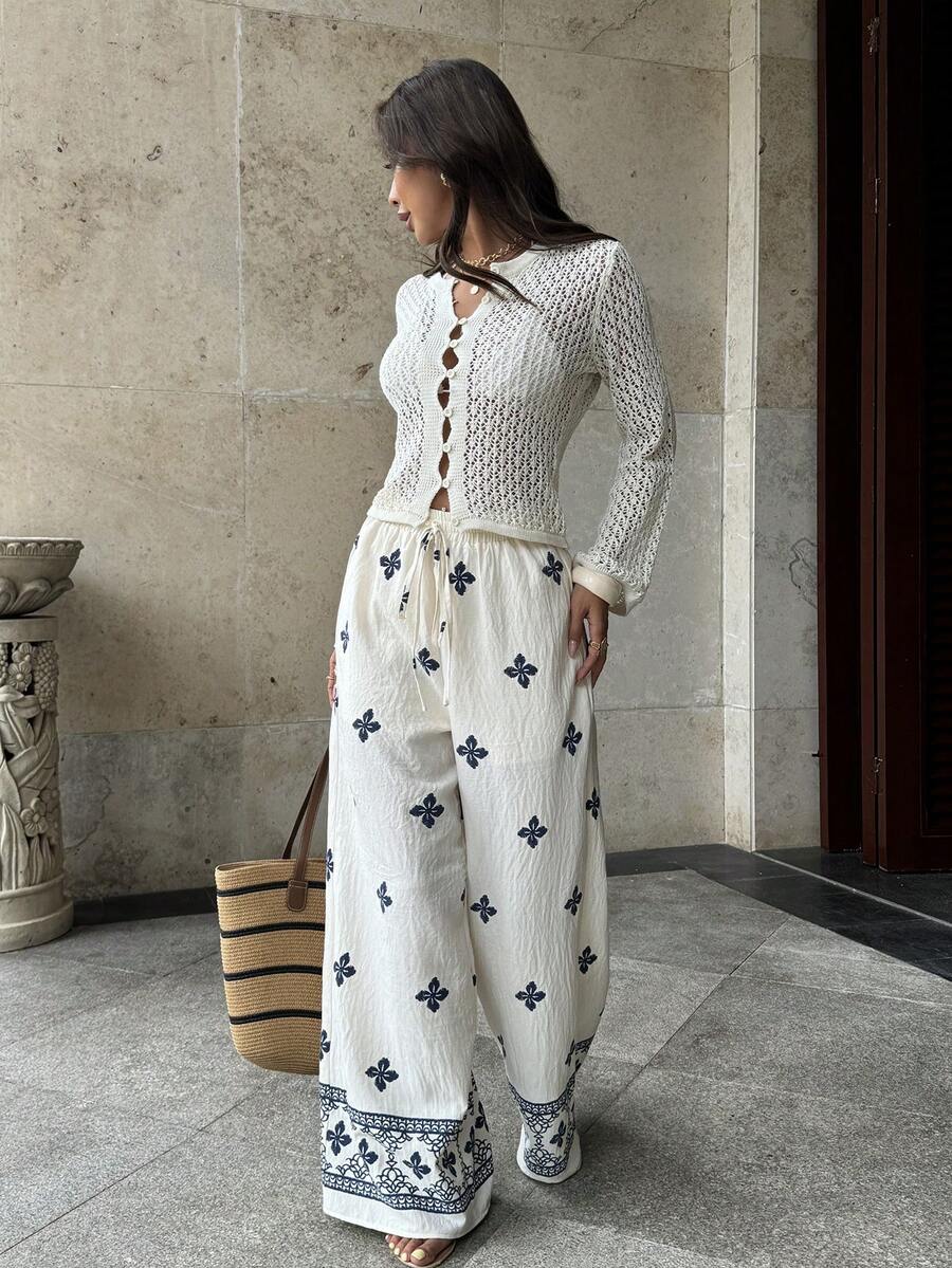 Pariaura Quần ống rộng kiểu Pháp Bohemian, màu xanh nhạt, họa tiết cỏ bốn lá. Eo co giãn có dây rút + gấu quần rộng, thoải mái. Thêu họa tiết hình học ở gấu quần. Phong cách đa năng, phù hợp mặc hàng ngày. - Màu be - Xem 1