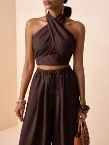 Zivah Lễ hội âm nhạc Xuân/Hè 2026, Lễ Phục Sinh, Ngày Thánh Patrick, Ngày Valentine, Hẹn hò, Phong cách miền Tây, Phong cách du mục, Tiệc sinh nhật, Lễ tốt nghiệp, Đại học, Sinh viên, Trang phục hàng ngày, Phối đồ cơ bản, Thường ngày, Kỳ nghỉ, Du lịch tàu biển, Bãi biển, Tắm nắng, Xu hướng thịnh hành, Thời trang đường phố, Khách dự đám cưới, Người đi làm, Ăn sáng muộn, Sân bay, Tiệc tùng, Đi chơi ngày lễ, Trang phục công sở, Bộ 2 món gồm áo cổ yếm buộc dây và quần ống rộng xếp ly màu nâu chất liệu vải lanh. - màu nâu - Xem 7