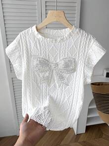 少女白色春夏休闲优雅宽松落肩圆领纹理刺绣细节串珠超大蝴蝶结装饰T恤，杏色 - 白色 - 查看 4