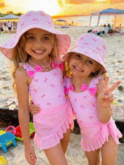 Emery Rose Kids Emery Rose Kids Conjunto de bañador a rayas con lazo y falda de cubrir para niña, ideal para vacaciones en la playa