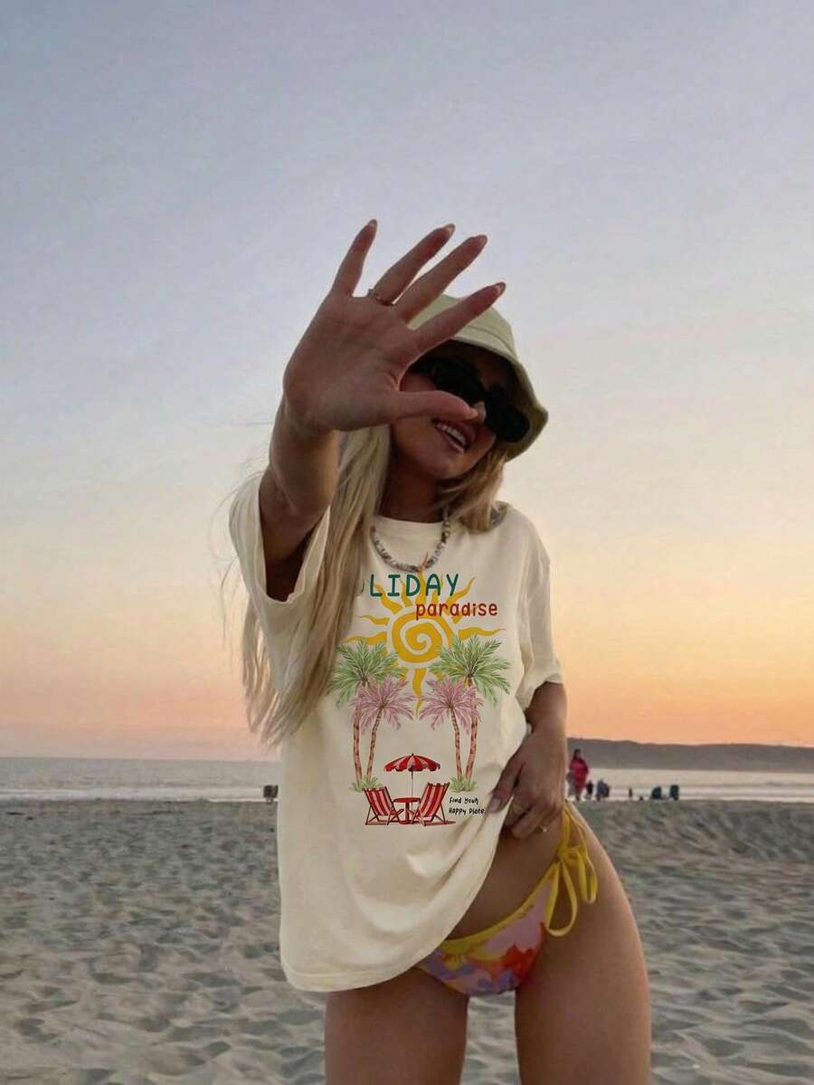 Aloruh 宽松T恤，饰有休闲棕榈树和法国里维埃拉图案，圆领短袖，宽松版型，适合夏季度假、海滩穿着。黄色夏季上衣，Y2K风格夏季服装，假日装扮，夏季女装，夏季度假装扮，夏季女装，夏季度假装扮，假日海滩装，女士度假服装。 - 杏色 - 查看 1