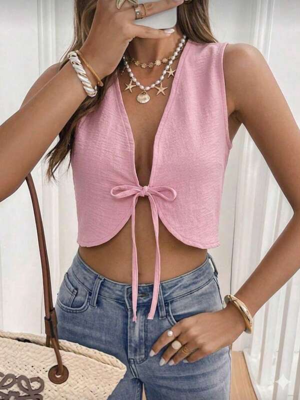 Top femenino corto escote profundo sin mangas nudo frontal crop estilo casual verano ligero moderno