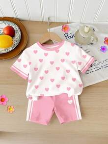 Bộ 2 món gồm áo thun ngắn tay cổ tròn in hình trái tim phối sọc tương phản và quần short đạp xe dành cho bé gái, thích hợp mặc hàng ngày vào mùa xuân/hè, phong cách đường phố, đi chơi, nghỉ mát, dự tiệc, đi học. Bộ quần áo bé gái in hình trái tim và quần short. - Nhiều màu - Xem 3