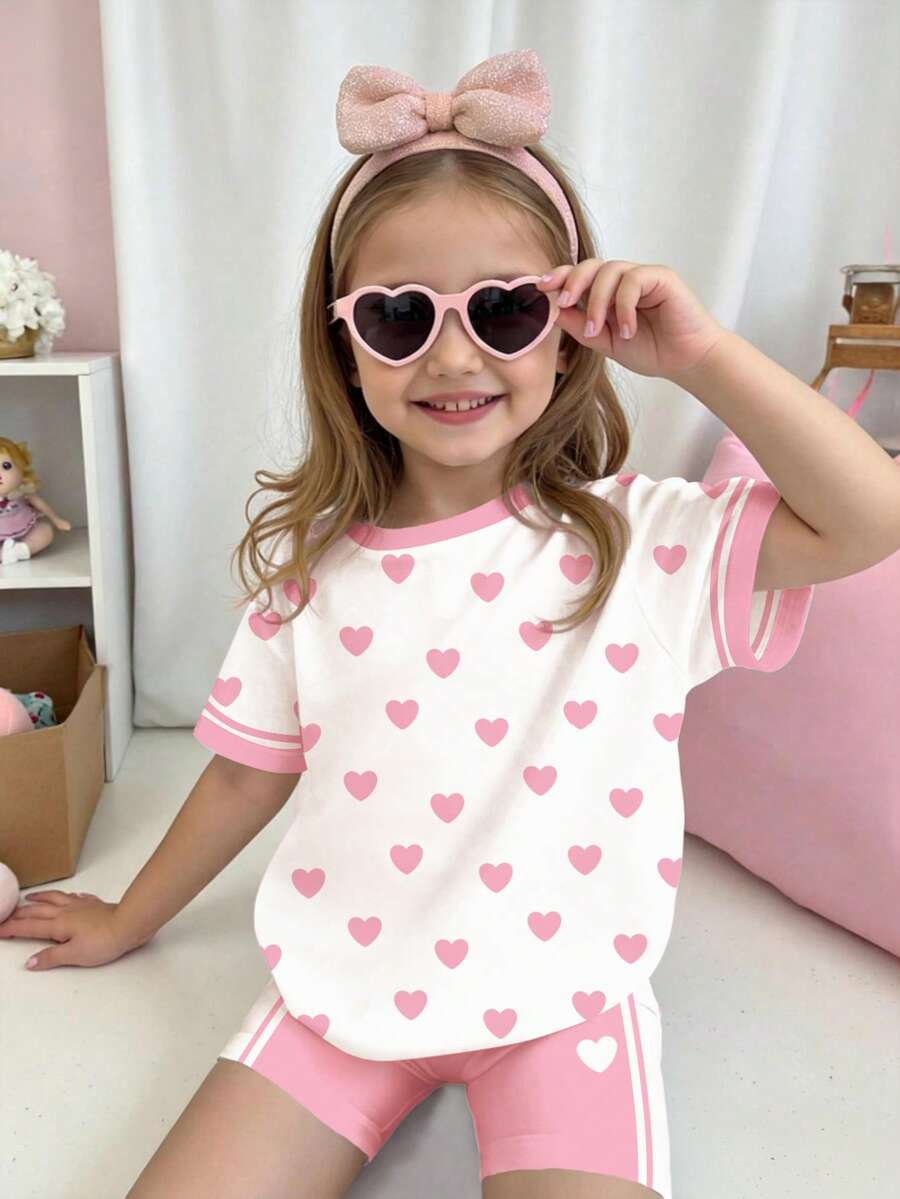 Bộ 2 món gồm áo thun ngắn tay cổ tròn in hình trái tim phối sọc tương phản và quần short đạp xe dành cho bé gái, thích hợp mặc hàng ngày vào mùa xuân/hè, phong cách đường phố, đi chơi, nghỉ mát, dự tiệc, đi học. Bộ quần áo bé gái in hình trái tim và quần short. - Nhiều màu - Xem 1