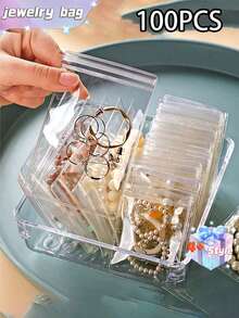 SHEIN 100 个 PVC 透明可重复密封珠宝袋，带拉链，抗氧化，防止失去光泽，用于存放耳环、项链、珠宝、小礼品、配饰派对礼品袋，透明拉链袋防氧化珠宝包装袋（珠宝）收纳盒 - 無色 - 查看 6