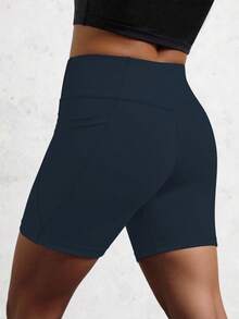 Dark Blue Athletic Shorts For Tween Girls, Featuring A Creative Paneled Construction With Functional Side Pockets, Made From High-Stretch Comfortable Fabric For Unrestricted Movement, Ideal For Cycling, Jogging, Yoga Sessions, And Versatile Training Activities - Navy Blue - View 2