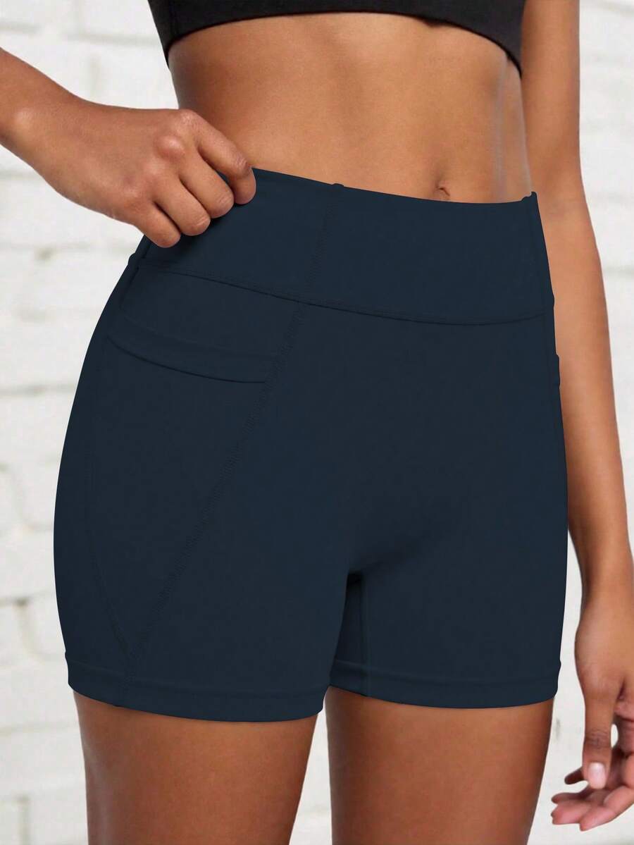 Dark Blue Athletic Shorts For Tween Girls, Featuring A Creative Paneled Construction With Functional Side Pockets, Made From High-Stretch Comfortable Fabric For Unrestricted Movement, Ideal For Cycling, Jogging, Yoga Sessions, And Versatile Training Activities - Navy Blue - View 1