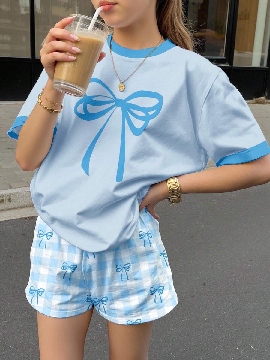 Bộ quần áo 2 mảnh cho bé gái tuổi teen, gồm áo ngắn tay và quần short in họa tiết kẻ caro xanh dương, kiểu dáng tối giản, thích hợp cho mùa hè. - Nhiều màu - Xem 1