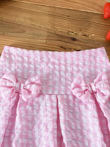 SHEIN Bộ đồ cho bé gái gồm áo dệt kim jacquard màu trắng cổ tròn tay ngắn thắt nơ và chân váy kẻ caro màu hồng. - Hồng - Xem 6