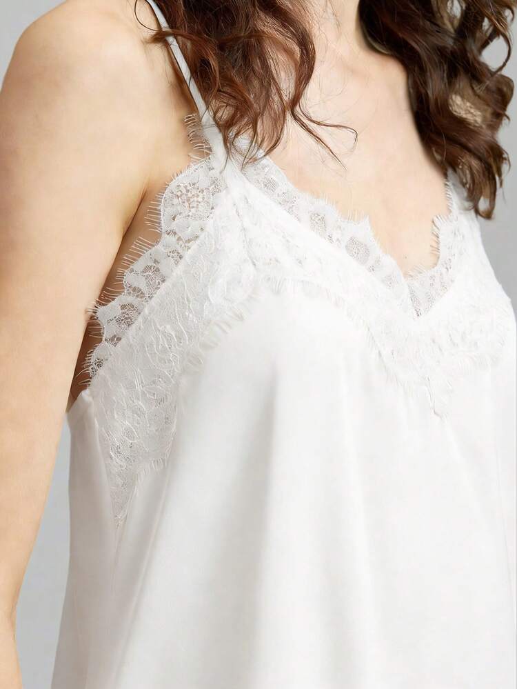 2026 Women's Satin Charmeuse Microelastic Fabric Comfortable Soft Spaghetti Strap Long Cami Top, Fitted Silhouette, Lace Trim Accent, Asymmetric Hemline Design, Modern Urban Casual Business Chic Office Wear, Low-Key Elegant Vibe, High-Quality Airport Fashion, Premium Material, Sophisticated Cruise, Graceful Aesthetic, Street-Style Inspired White Satin Cami White Cami Top Lace Trim Top White Top Women Spaghetti Strap Top Bohemian Style Vacation Outfits Seaside Women's Clothing, Country Music