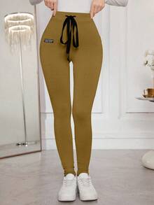 Modelyn Quần legging ôm sát, màu trơn, có dây rút, co giãn tốt. - Vàng nhạt - Xem 6