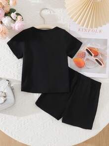 SHEIN Baby Girls' Chic 2-Piece Black Outfit Set, Short Sleeve Crew Neck Top With White Bow Accents & Side Stripe Details, Matching Elastic Waist Shorts With Bows, Ultra-Soft Lightweight Breathable Fabric, Sweet Sporty Casual Style For Everyday Wear, Playdates & Outdoor Activitie - Black - View 2
