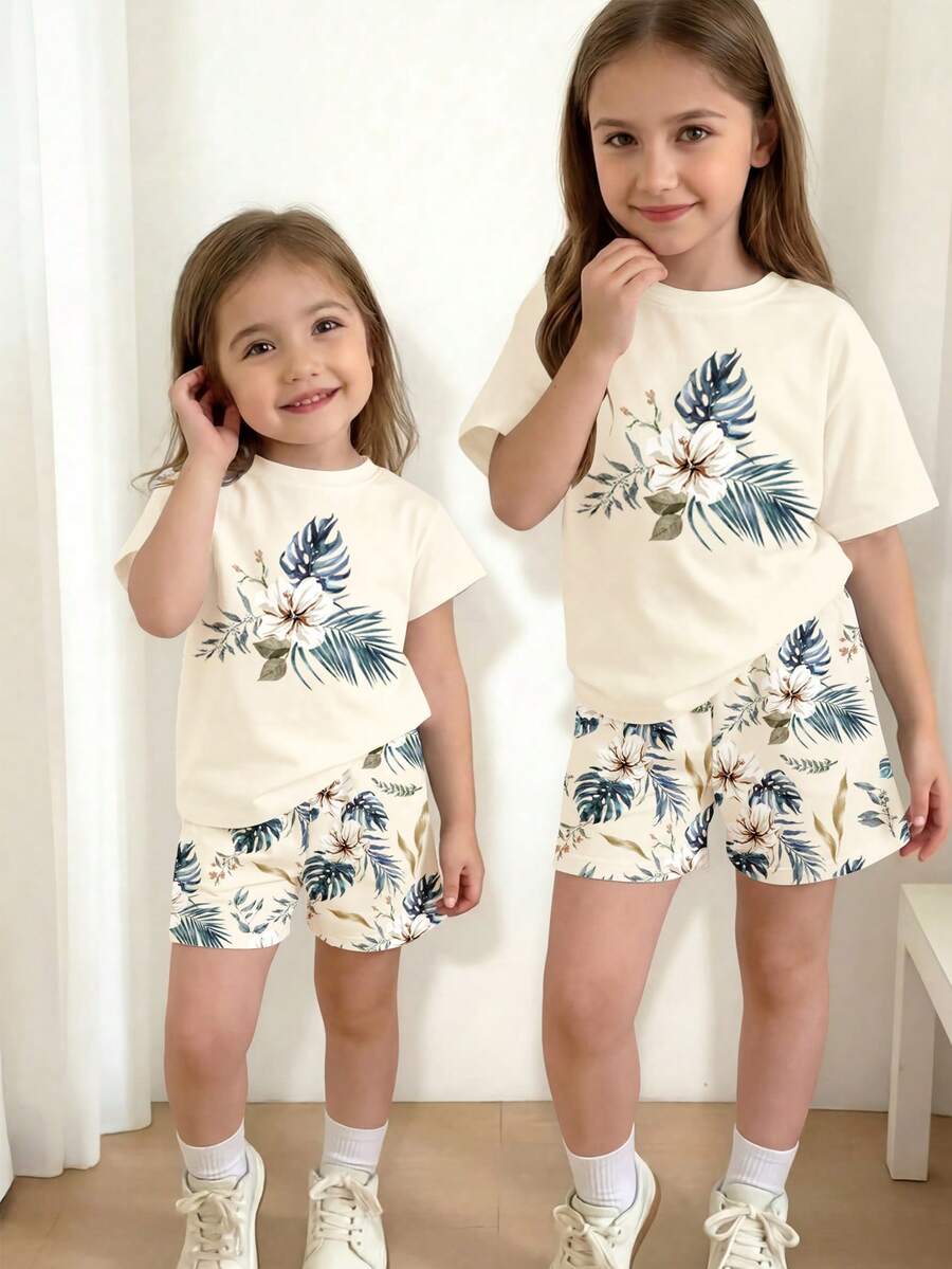 Bộ 2 món gồm áo thun ngắn tay cổ tròn và quần short in họa tiết hoa lá nhiệt đới, thích hợp mặc hàng ngày vào mùa xuân/hè, đi chơi, du lịch hoặc nghỉ lễ. - Nhiều màu - Xem 1